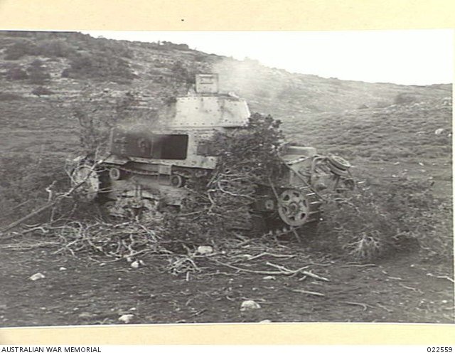 Italian Carro Armato M13/40 captured near Barce, Libya, December 1941. service/combat photograph, Shows terrain and damage context. [AWM-022559].