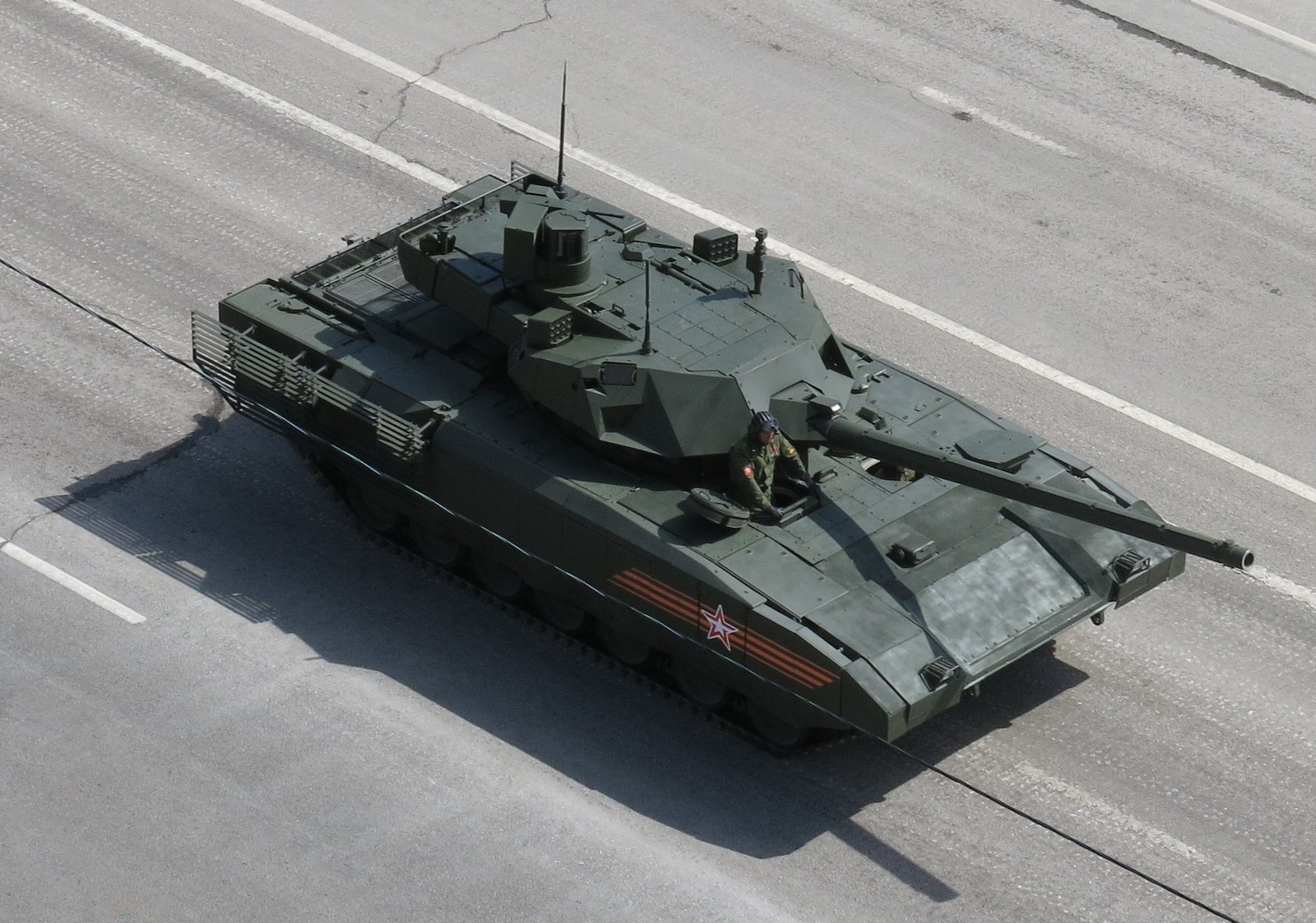 Overhead view of a T-14 prototype during the 2015 parade period, Moscow, Russia, May 9, 2015. Vehicle/variant identification: T-14 prototype/pre-series tank. Source/. Shows hull deck and turret-module layout; photographed in parade context. [S18].