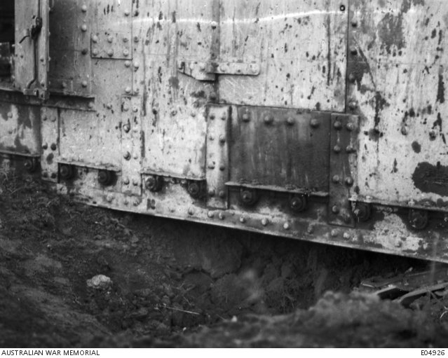 Close-up of a damaged Mark V* Female tank at Ronssoy on 30 September 1918, disabled by a land mine; Australian War Memorial E04926.