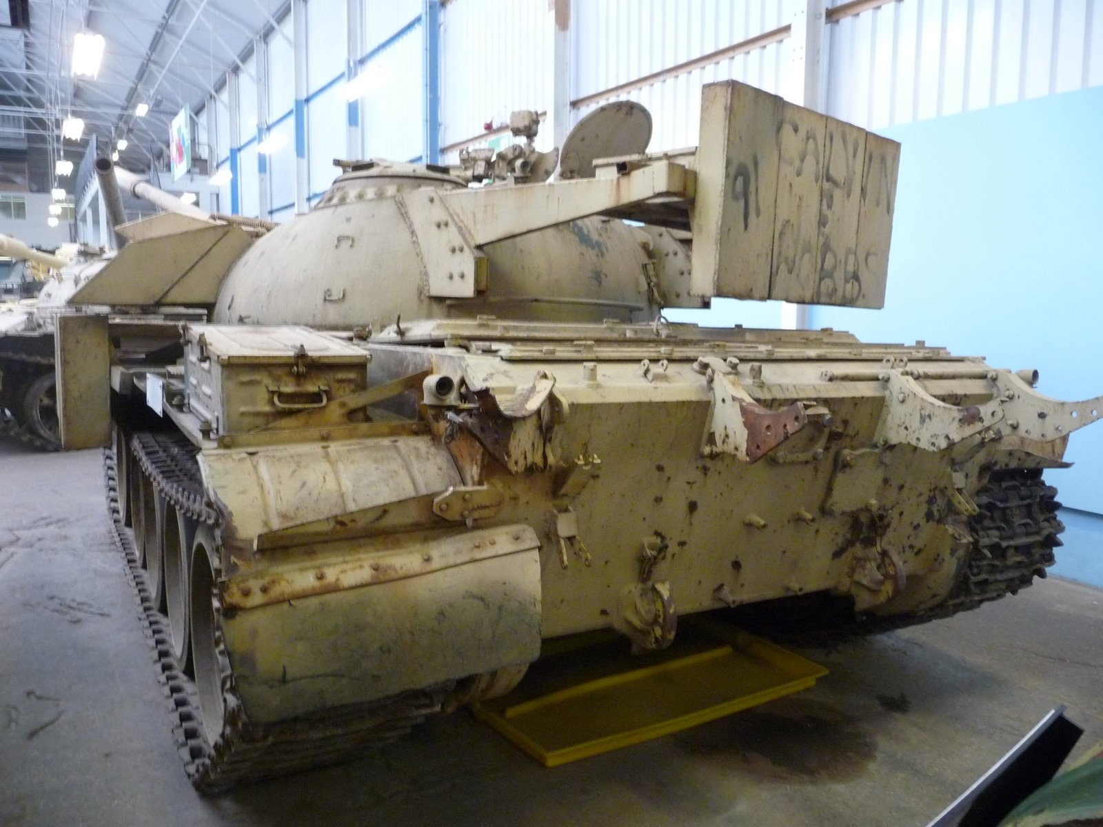 Rear view of the Bovington T-55 Enigma, photographed 18 April 2010 by Simon. The rear turret counterweight/box structure and the added bracketed modules are visible.