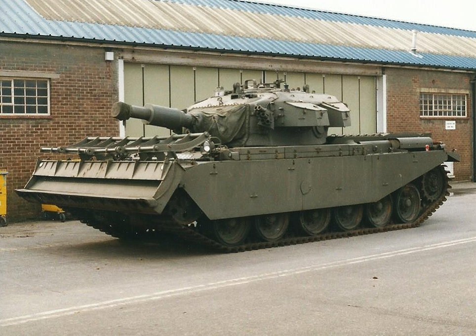 Centurion AVRE 165 with 165 mm L9A1 demolition gun and dozer blade at Bovington. Date on Commons/Flickr file: 15 December 2015; description identifies Bovington, Dorset, March 1998. museum/display vehicle; illustrates specialized Royal Engineers branch.