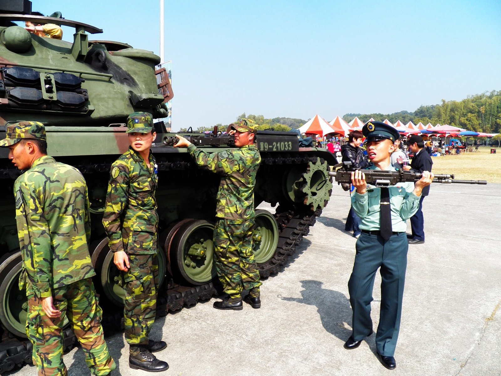 ROC personnel removing machine guns from a CM-12 after the 2012 ROCA Infantry School event. This is a service/display-handling view rather than combat deployment.