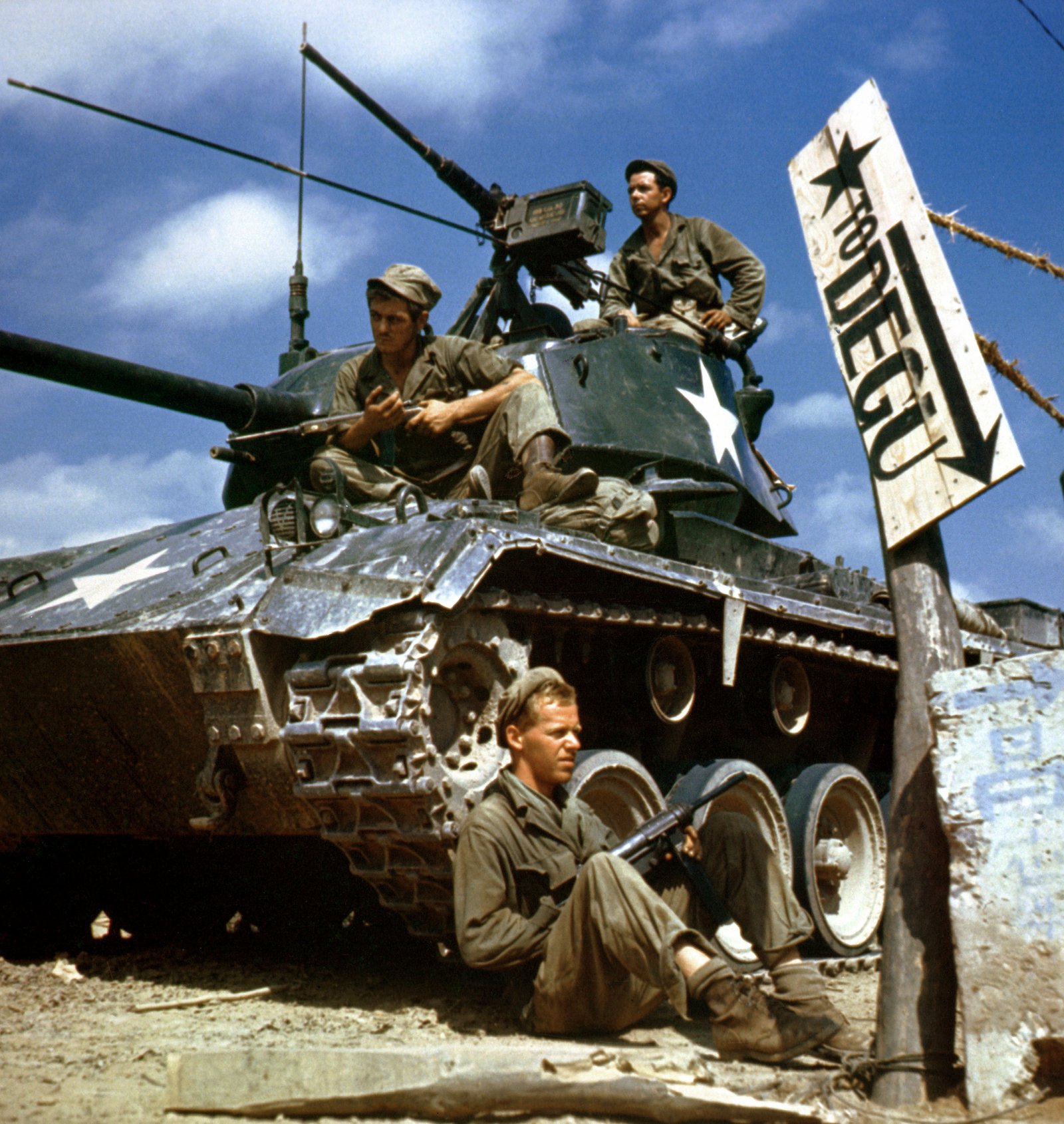 Crew of an M24 Chaffee along the Naktong River front, Korea, 17 August 1950. caption identifies Pfc. Rudolph Dotts, Pvt. Maynard Linaweaver, and Pfc. Hugh Goodwin of 24th Reconnaissance, 24th Division. URL/.