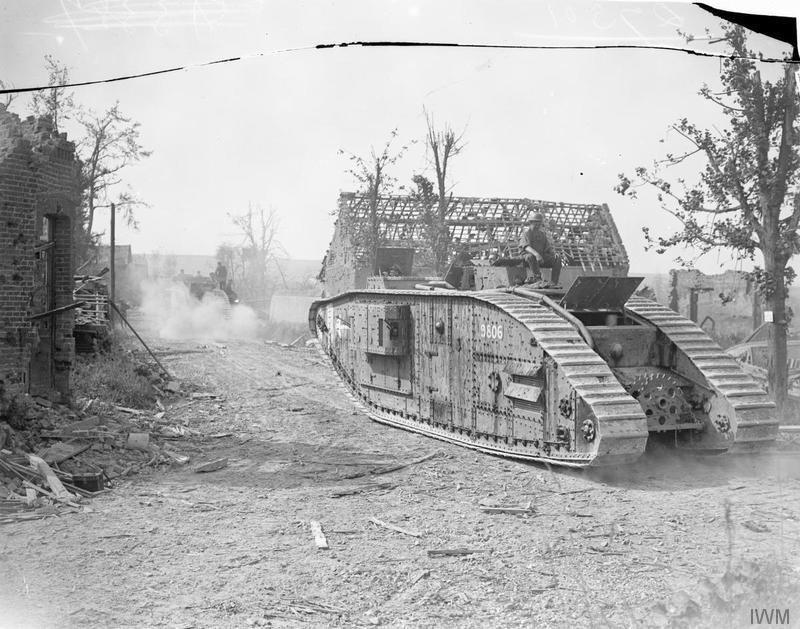 Mark V Female tanks of the 4th Battalion, Tank Corps, passing through Meaulte on 22 August 1918; Imperial War Museums photograph Q 7301.