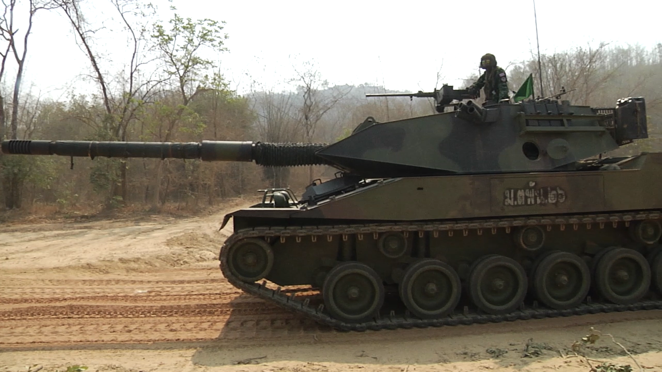 Royal Thai Army Stingray light tank in side/front aspect during Cobra Gold 2019 live-fire training, Sukhothai, Thailand, 21 February 2019. Shows turret shape, 105 mm gun, roof machine-gun position, and road-wheel layout.