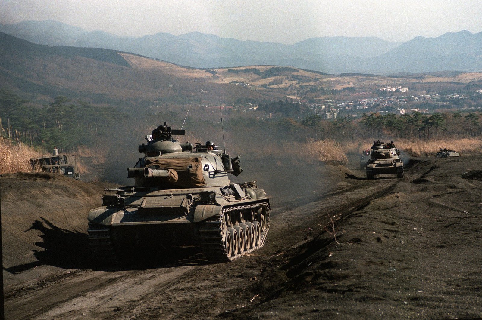 JGSDF Type 61 tanks moving into position during bilateral Exercise Orient Shield at Camp Fuji, Japan, 18 November 1985.