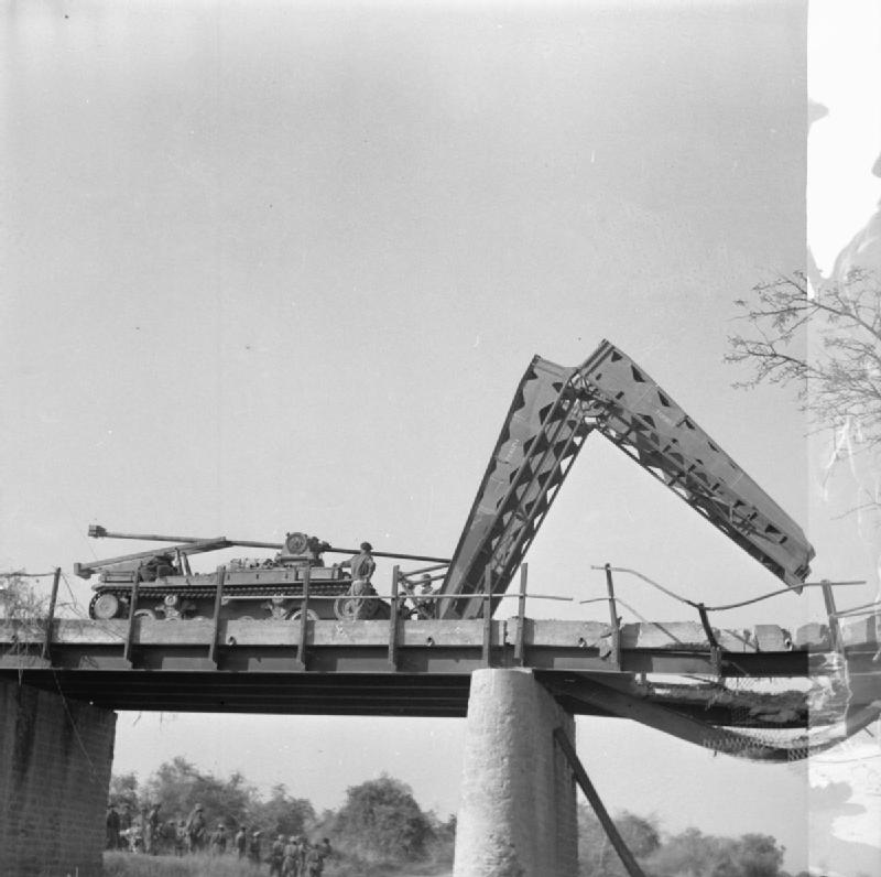 Valentine bridgelayer spanning a damaged bridge near Meiktila, Burma, 28 March 1945. Source/.