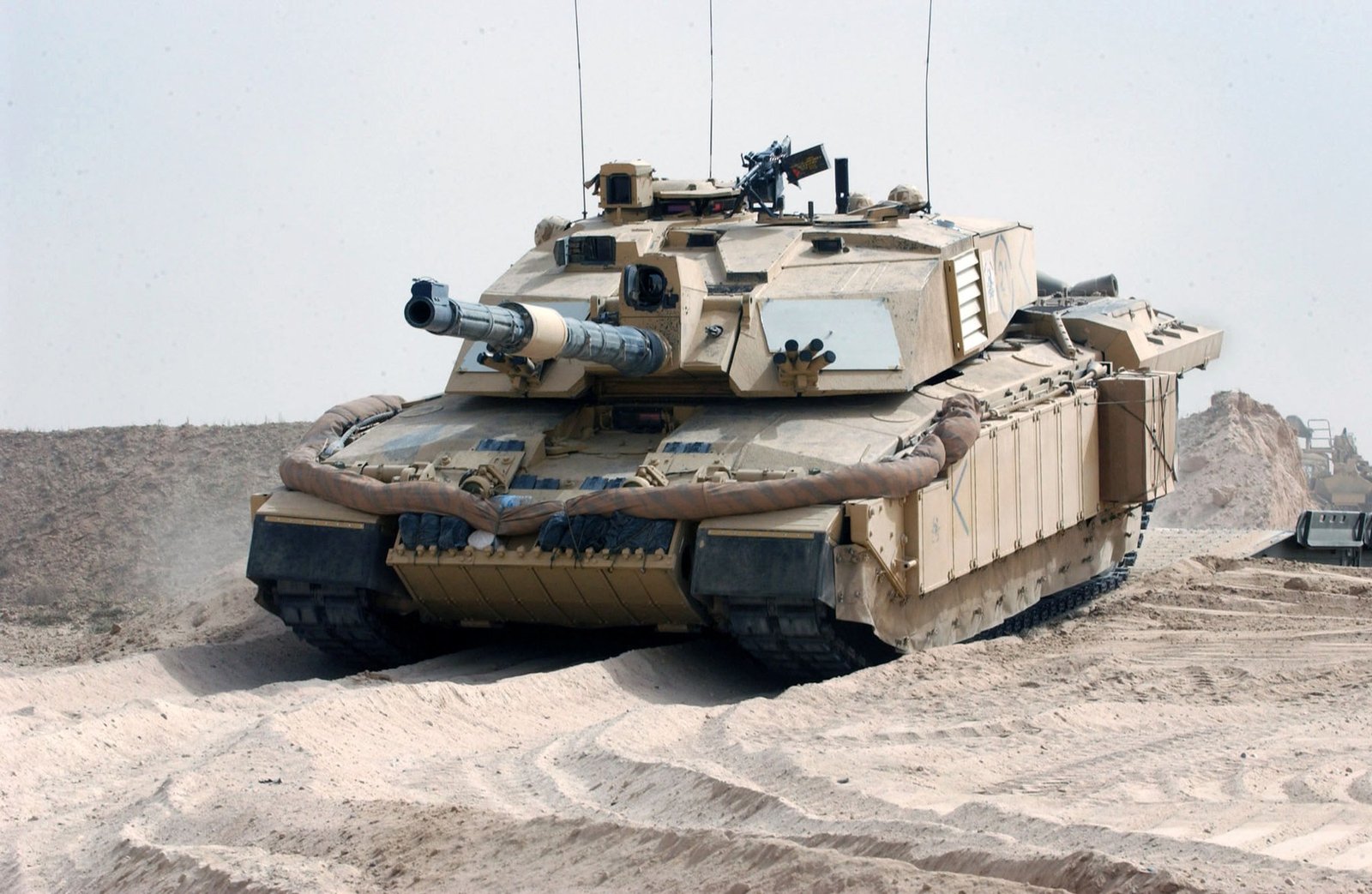 A Challenger 2 of the Queen’s Royal Lancers crosses an Iraqi defensive ditch using a General Support Bridge on 21 March 2003. Kuwait/Iraq border area. shows combat-mobility context with engineer support, not an isolated technical-detail view. Source citation: [IMG3].