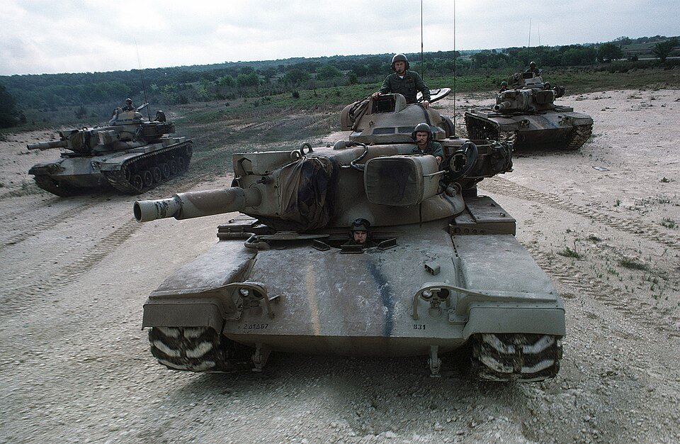 Three M60A2 tanks participate in a field exercise, 1 April 1975. The low-profile turret and short 152 mm gun/launcher distinguish the M60A2 'Starship' from the 105 mm gun tanks. Credit: U.S. National Archives record 6399005 via Wikimedia Commons; photographer unknown. Useful service image for the M60A2; production quantity remains source-conflicted.
