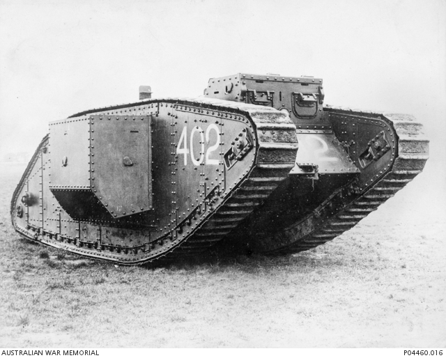 Unarmed Mark IV Supply Tank no. 402 at an unidentified air base in 1918; the Australian War Memorial describes aircraft-tug use as probable.