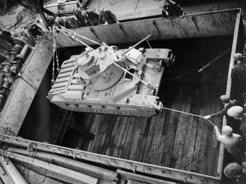 A Matilda II being lowered into a ship's hold at a British port, 1939-1945. British port, exact port not identified.