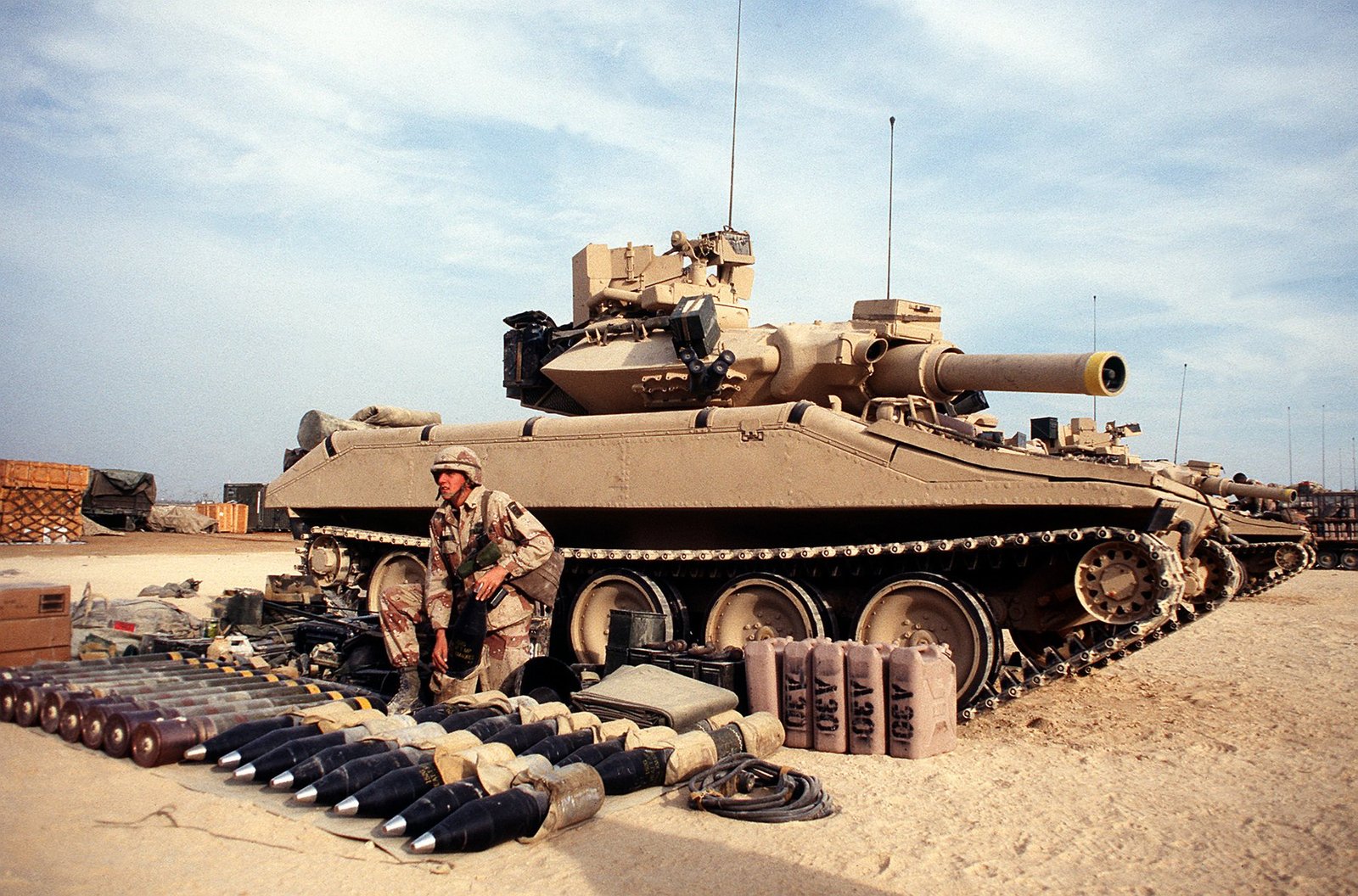 M551A1 Sheridan of Company A, 3rd Battalion, 73rd Armor, 82nd Airborne Division, with ammunition laid out before a live-fire exercise during Operation Desert Shield. This image shows the late-service M551A1 in desert deployment context.