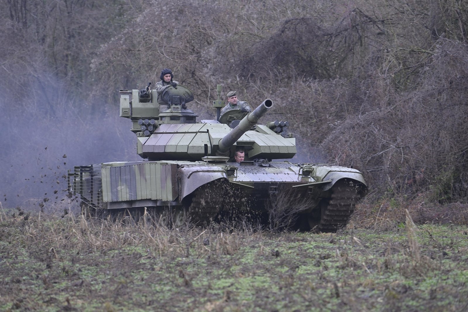 M84AS2 in motion, 30 December 2021. Shows side/frontal view of armor and cage additions; exact location not stated in file metadata.