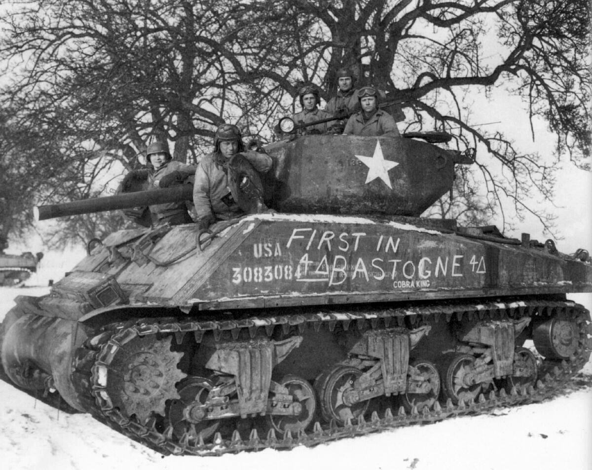 “Cobra King” crew near Bastogne, December 1944.