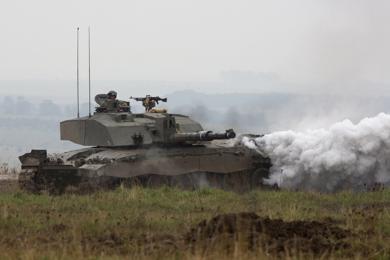 Challenger 2 laying a smoke screen during maneuvers on Salisbury Plain near Warminster, 9 October 2012. illustrates obscuration/smoke employment and side profile. Source citation: [IMG6].