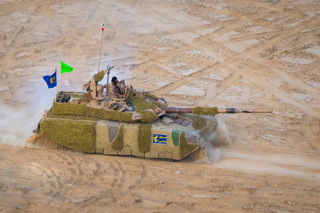 Karrar with thermal-camouflage system in exercise setting. IRGC-GF Karrar main battle tank during Great Prophet 17, photographed with thermal-camouflage cover. 22 December 2021. southern Iran exercise area, exact site not specified. image helps document the 2021 thermal concealment configuration reported by Iranian media. Source.